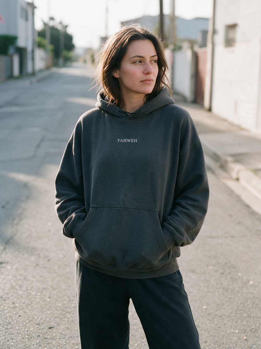 Unashamed Yahweh Hoodie worn on a quiet street