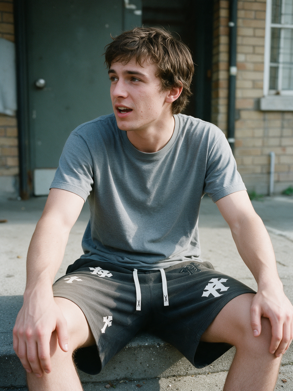 Unashamed Cross Shorts worn on concrete steps